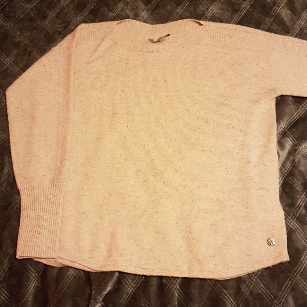 Women's pink Royal Robbins sweater.